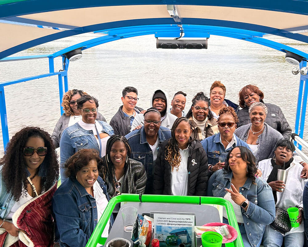 large group of black people on a pedal cruise