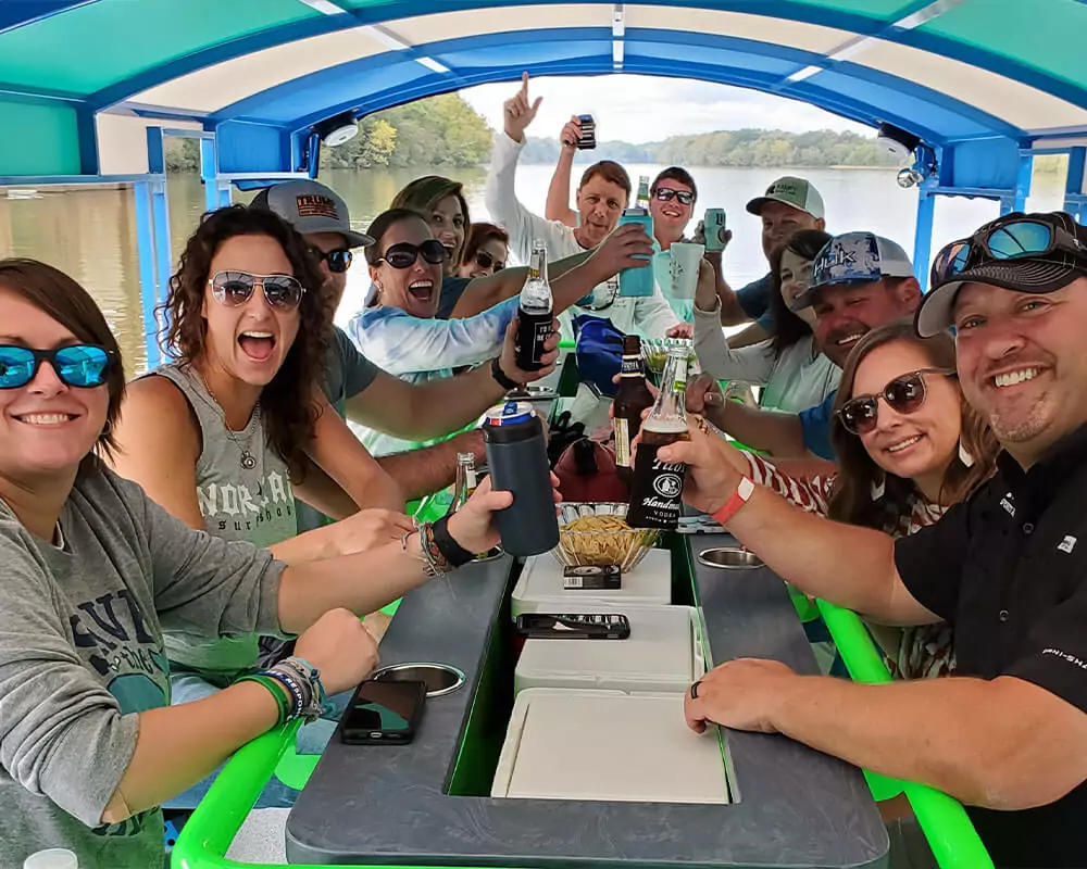 group of people having fun and laughing on a pedal cruise