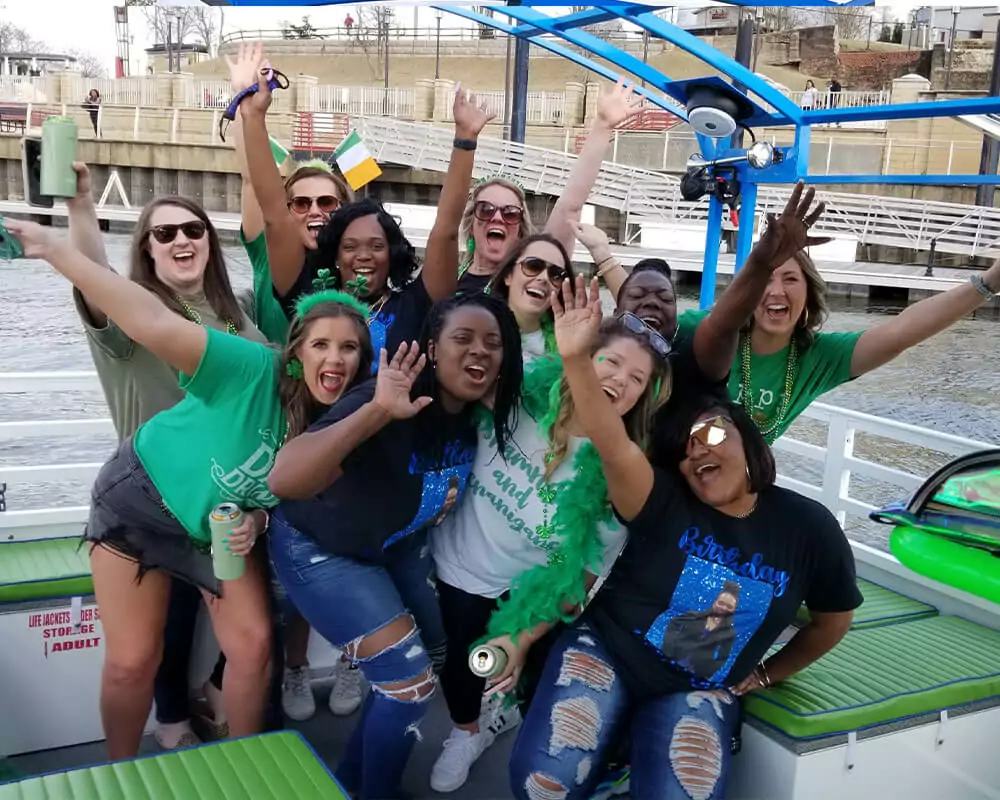 group of women posing for a photo on a pedal cruise
