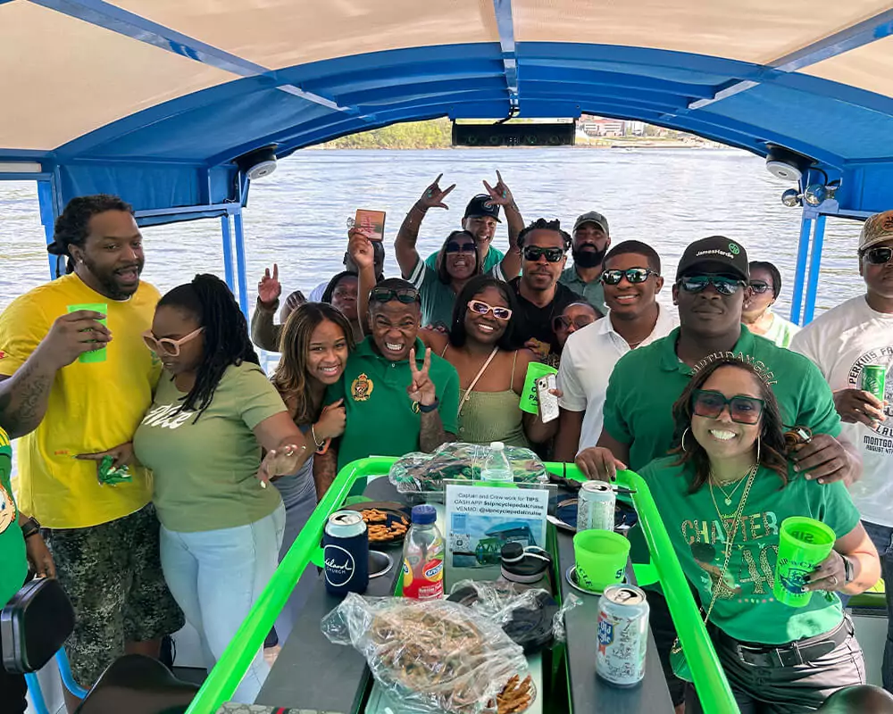 black people having fun on a pedal cruise